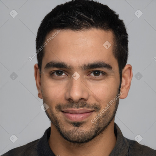 Joyful white young-adult male with short  black hair and brown eyes