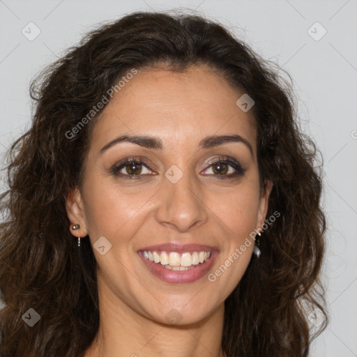 Joyful white adult female with long  brown hair and brown eyes