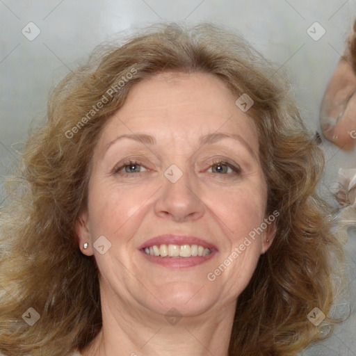 Joyful white adult female with medium  brown hair and blue eyes