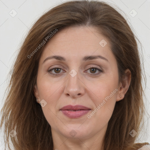 Joyful white adult female with long  brown hair and brown eyes