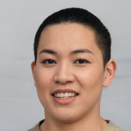 Joyful latino young-adult female with short  black hair and brown eyes