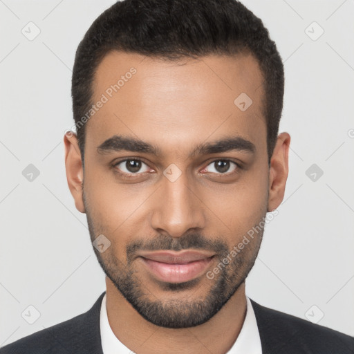 Joyful black young-adult male with short  brown hair and brown eyes