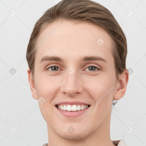 Joyful white young-adult female with short  brown hair and grey eyes