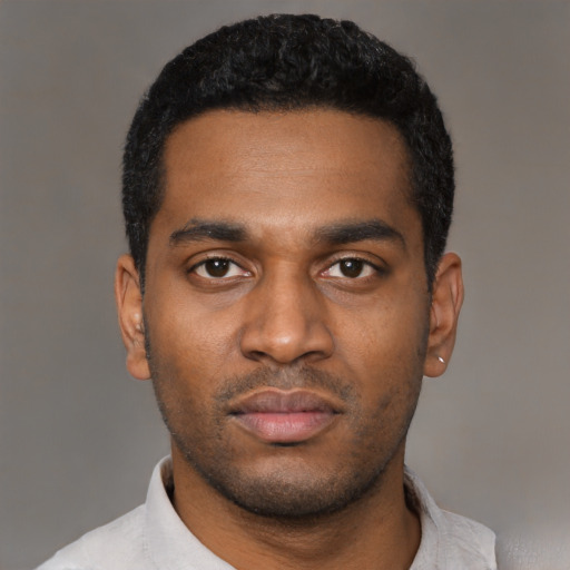 Neutral latino young-adult male with short  black hair and brown eyes
