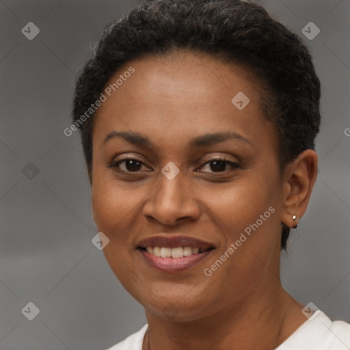 Joyful black young-adult female with short  brown hair and brown eyes