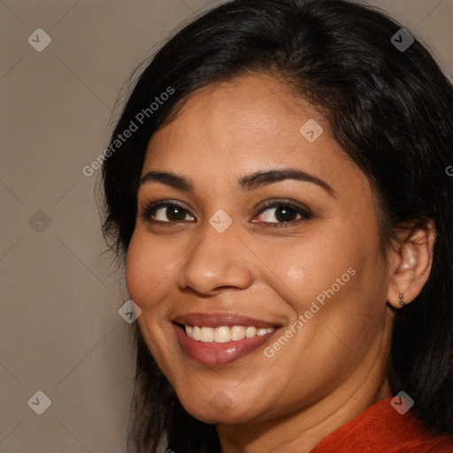 Joyful latino young-adult female with medium  brown hair and brown eyes