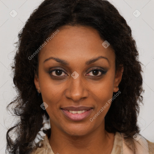 Joyful black young-adult female with long  brown hair and brown eyes