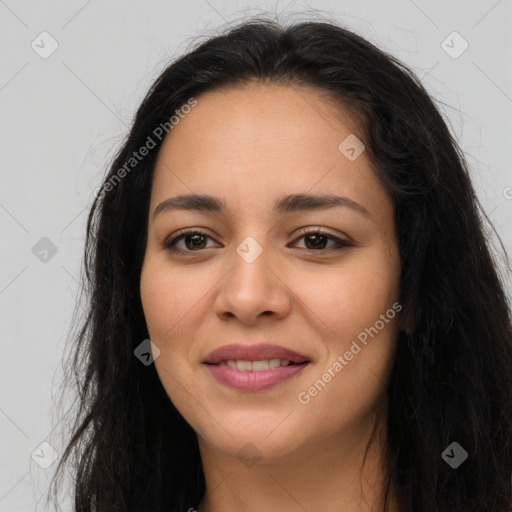 Joyful latino young-adult female with long  brown hair and brown eyes