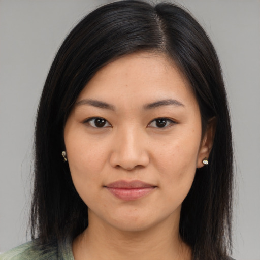Joyful asian young-adult female with long  brown hair and brown eyes