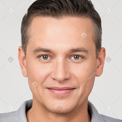 Joyful white young-adult male with short  brown hair and brown eyes