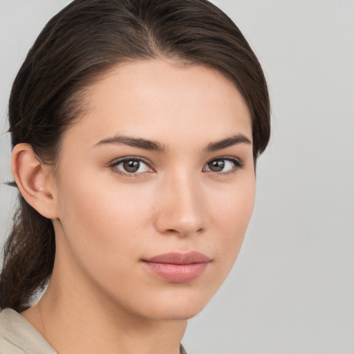 Neutral white young-adult female with medium  brown hair and brown eyes