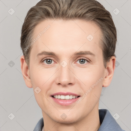 Joyful white young-adult female with short  brown hair and grey eyes