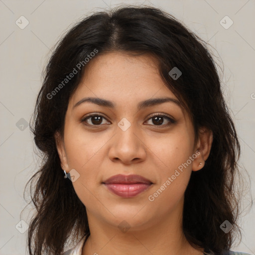 Joyful latino young-adult female with medium  brown hair and brown eyes