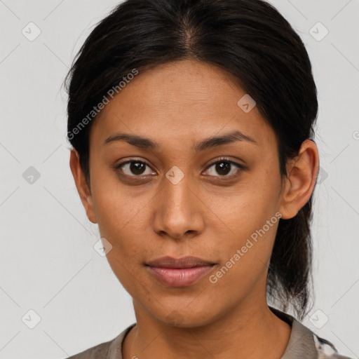 Joyful latino young-adult female with short  brown hair and brown eyes