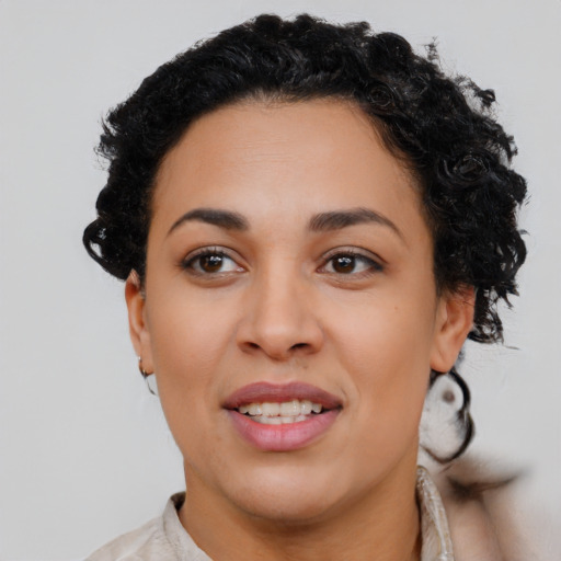 Joyful latino young-adult female with short  brown hair and brown eyes