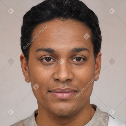 Joyful black young-adult male with short  black hair and brown eyes