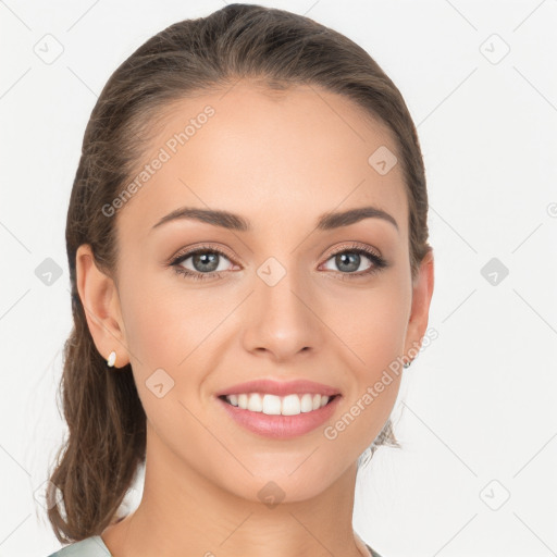 Joyful white young-adult female with long  brown hair and blue eyes