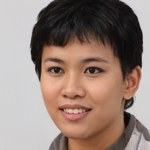 Joyful asian young-adult female with short  brown hair and brown eyes