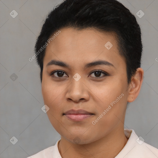 Joyful latino young-adult female with short  black hair and brown eyes