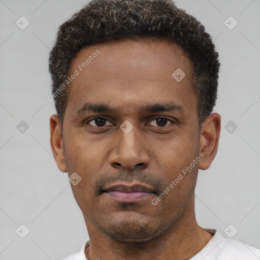 Neutral latino young-adult male with short  black hair and brown eyes