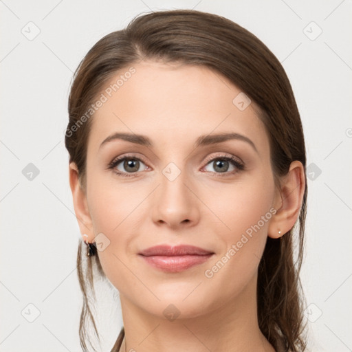 Joyful white young-adult female with long  brown hair and grey eyes