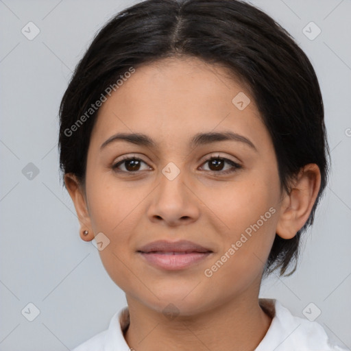 Joyful latino young-adult female with medium  brown hair and brown eyes