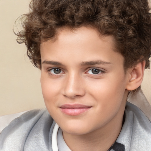 Joyful white child male with short  brown hair and brown eyes