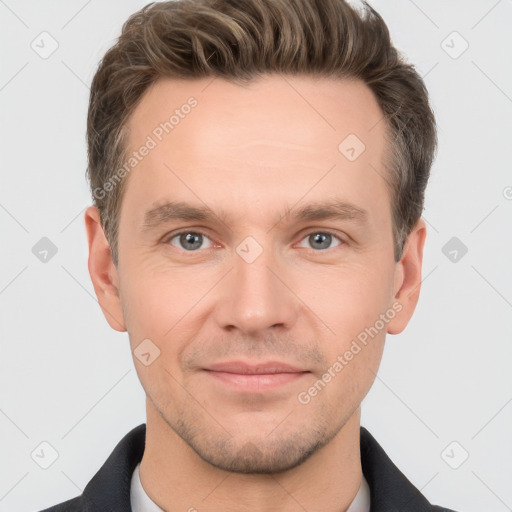 Joyful white adult male with short  brown hair and grey eyes