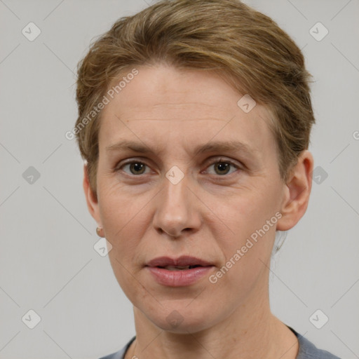 Joyful white adult female with short  brown hair and grey eyes