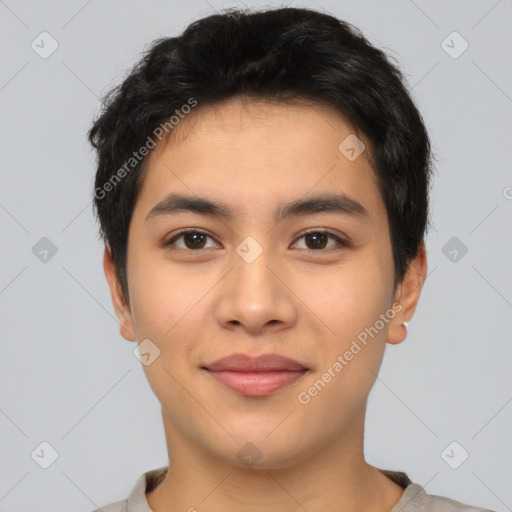 Joyful asian young-adult male with short  black hair and brown eyes