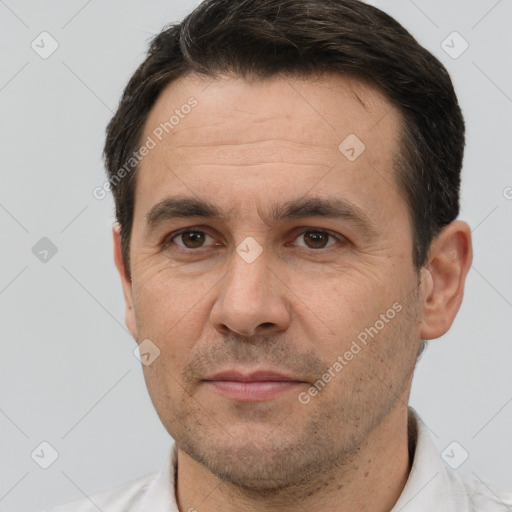 Joyful white adult male with short  brown hair and brown eyes