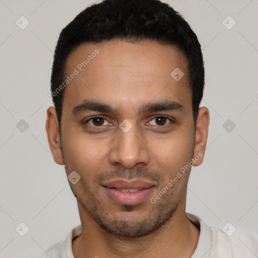 Joyful white young-adult male with short  black hair and brown eyes