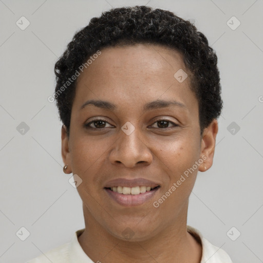 Joyful black young-adult female with short  black hair and brown eyes