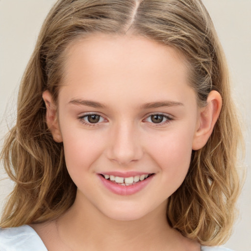 Joyful white child female with long  brown hair and brown eyes