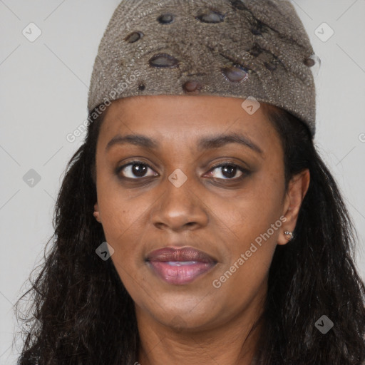 Joyful black young-adult female with long  black hair and brown eyes