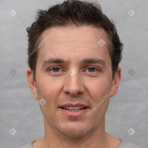 Joyful white adult male with short  brown hair and grey eyes