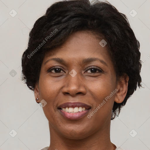 Joyful black adult female with short  brown hair and brown eyes