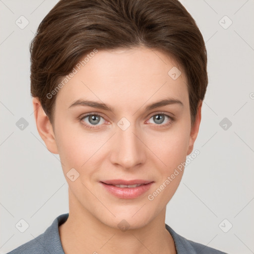 Joyful white young-adult female with short  brown hair and grey eyes