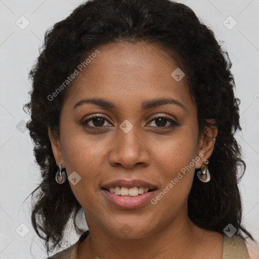 Joyful black young-adult female with long  brown hair and brown eyes