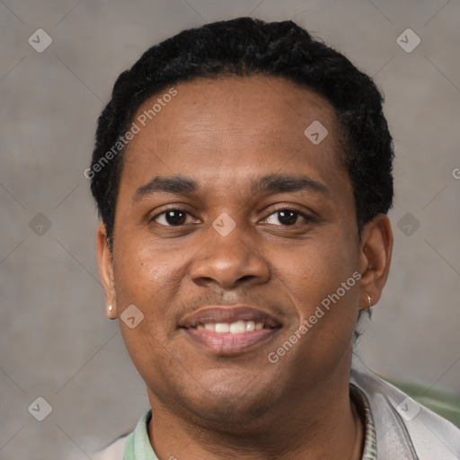 Joyful black young-adult male with short  black hair and brown eyes