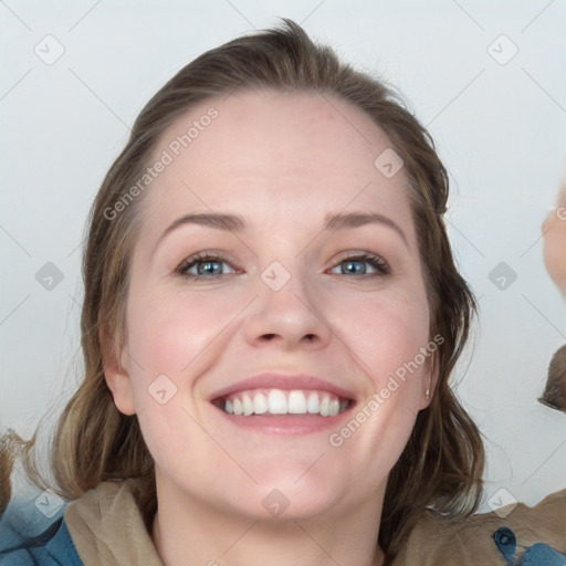 Joyful white young-adult female with medium  brown hair and blue eyes