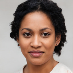 Joyful latino young-adult female with medium  black hair and brown eyes