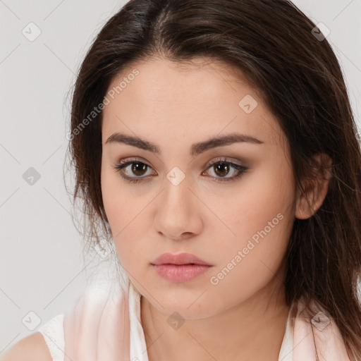 Neutral white young-adult female with long  brown hair and brown eyes