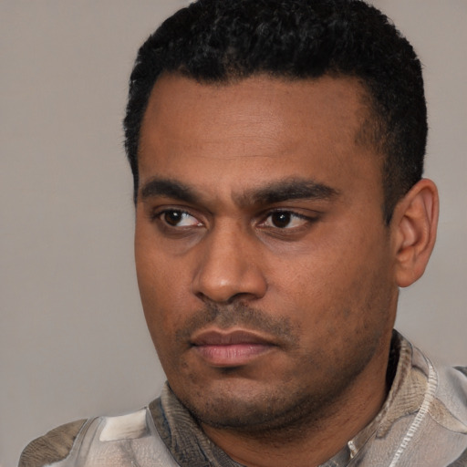 Neutral latino young-adult male with short  black hair and brown eyes