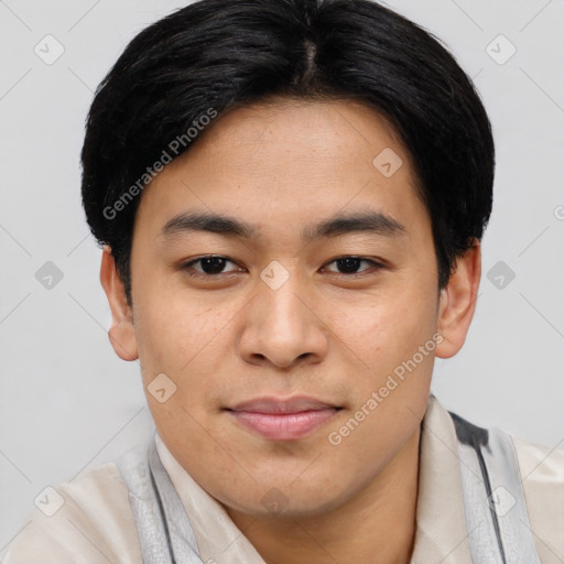 Joyful asian young-adult male with short  black hair and brown eyes