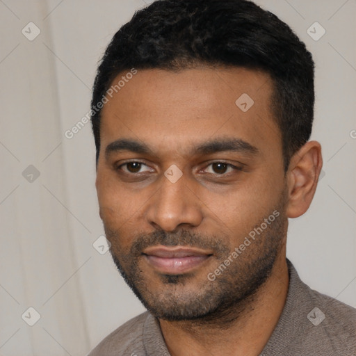 Joyful latino young-adult male with short  black hair and brown eyes