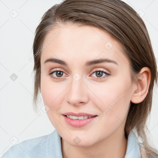 Joyful white young-adult female with medium  brown hair and blue eyes