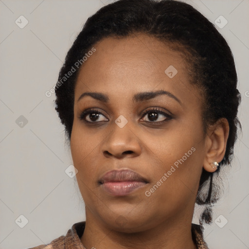 Joyful black young-adult female with medium  black hair and brown eyes