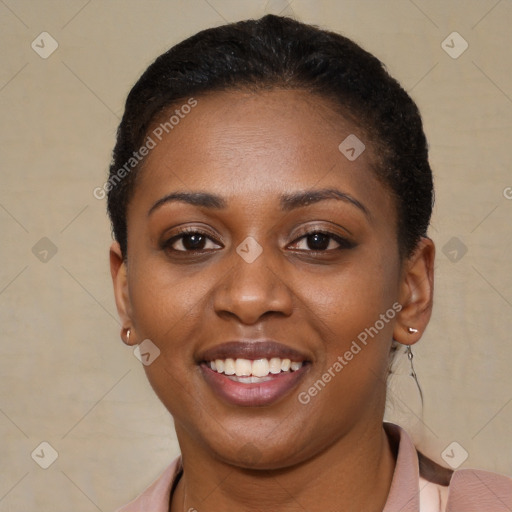 Joyful black young-adult female with short  brown hair and brown eyes