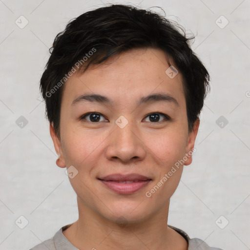 Joyful asian young-adult female with short  brown hair and brown eyes